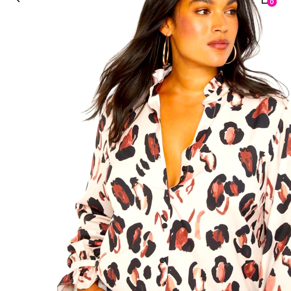 ELOQUII animal print button down top with ruffle collar and sleeves.